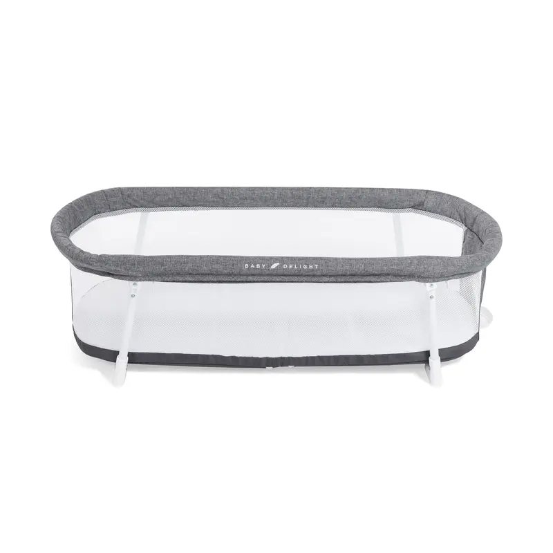 Snuggle Nest Portable Bassinet With Adjustable Height & Ventilation 1